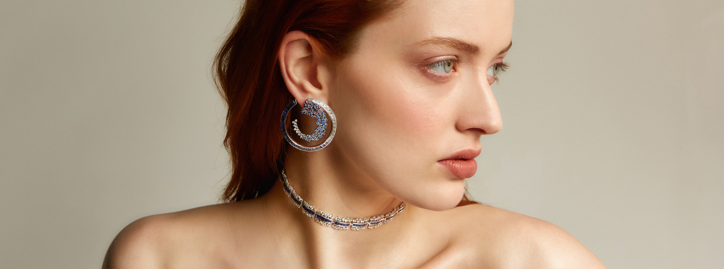 Ananya Fine Jewellery Scatter Collection Petite Regal Choker Blue Sapphire and White Sapphire Diamond Ombre Hoop Earrings crafted in 18K White Gold. They are set with Round White Diamonds, Iolite and Tanzanite